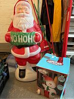 Santa blow mold holding 'HO HO HO' wreath photo showing overall condition and color