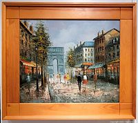 Front view of framed oil painting showing entire Parisian street scene and wood frame