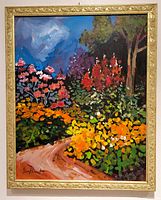 Angled full view of framed painting on wall