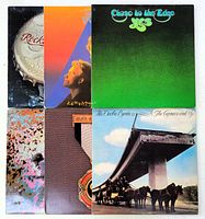 All six vinyl record jackets stacked vertically showing edge designs and front covers, representing the full lot.