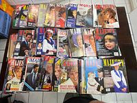 Overview of Majesty magazines laid out on a table showing various front covers mainly featuring Princess Diana, Prince Charles, and other members of the British royal family.
