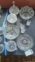 Full lot overview with all crystal glassware displayed on table.
