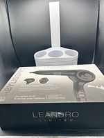 Photo of BabylissPro Leandro Limited hair dryer box with Polder organizer behind it showing product branding and packaging.