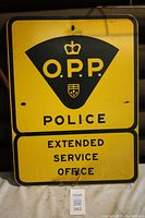 Full front view of the OPP Police Extended Service Office aluminum road sign showing overall condition and visible text