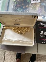 Faux pearl necklace displayed in cream-lined box marked MALLORCA Deliah