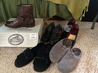 Five pairs of shoes including Frye boots, black slip-ons, slippers, and burgundy heels