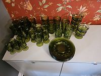 Full set including side plates stacked, dessert cups, tumblers, mid-size goblets and small glasses