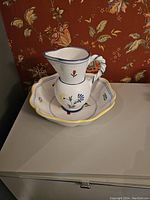 Pitcher and bowl together showing full set and floral decorations