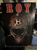 Front view of plaque showing goalie mask with Montreal Canadiens logo and ROY lettering on top.