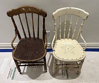 Two antique wood chairs side-by-side on a light floor, one dark wood and one white painted with star design on seat, showing wear.