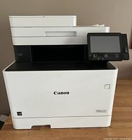 Front view of Canon printer showing overall design and condition