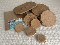 Group photo showing assortment of cork pads and coasters along with packaging labels.
