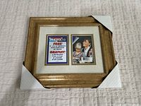 Front view of vintage gold picture frame holding two 4x6 placeholders, corners protected with white guards.