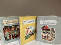 Front view of three vintage music books from 1958, showing titled covers with illustrations.