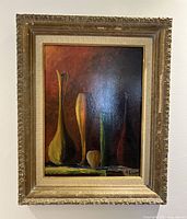 Full view of vintage oil painting showing five stylized vases in different colors with an ornate carved frame showing wear.