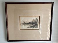 Complete framed watercolour print with visible brown wooden frame and matting.