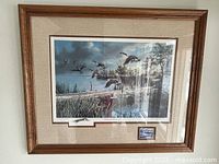 Frontal image of framed print showing the full piece, signature, and stamp below the print.