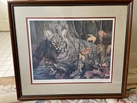Full framed print showing bobcat in autumn forest with double mat and dark wood frame