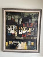 Full front view of framed painting hung on wall