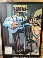 Full view of the framed painting "Coyote Bluesman" by Markus Pierson with visible subject matter and signature.