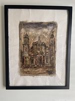 Frontal image of framed artwork showing sepia cathedral with textured background on handmade paper.