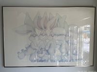 Full view of framed poster print depicting six cartoon rabbits in close grouping, reflecting light on surface.