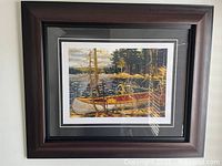 Full view of the professionally framed print "The Canoe" showing the artwork and frame.