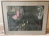 Full view of framed abstract artwork showing muted colors and abstract forms.