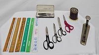 Full lot with all items: rulers, scissors, Parker pen set, brass pencil caddy, antique stapler