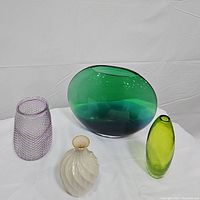 All four vases displayed on a white cloth background for overview.