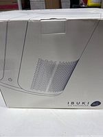 Box of the IBUKI Air Enhancer showing the perforated design drawing of the device and brand name.