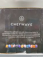 Close-up of box branding and product description highlighting the premium materials and intuitive design for espresso brewing.