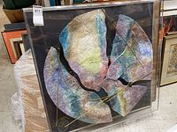 Front view of the large framed abstract geometric art sculpture with plexiglass enclosure.
