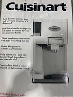 Photo of the boxed Cuisinart Soft Serve Ice Cream Maker showing features and brand on box.