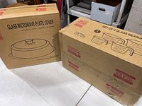 Original boxed glass microwave plate cover with depiction of the product on box.