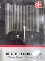 Front view of product box showing the RF-X Reflexion Filter with acoustic foam panel and clamp arm.