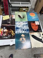 All 8 vinyl LP records arranged on a table showing album cover art