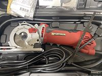 Platinum Rotorazer electric saw in original carrying case with power cord coiled.