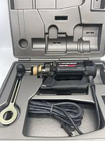 Rotozip Spiral Saw in carrying case with power cord and wrench included.