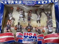 Front view of 10 USA Olympic basketball figurines in original blue and red Starting Lineup box with visible wear and window creases.