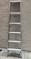 Front view of 6ft aluminum step ladder showing all 5 steps and non-slip feet caps.