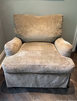 Front view of chair showing overall design, seat cushion, back cushion.