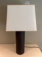 Full front view of lamp showing base and shade