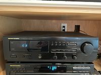 Front view of Marantz SR-48 MK2 receiver with digital display showing 'CD' and buttons for operation and tuning, displaying the unit's condition and working status.