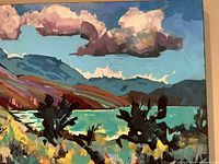 Foreground detail showing wildflowers, shrubs and lake