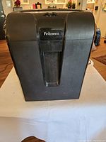 Front view of black Fellowes 63CB paper shredder showing layout and branding
