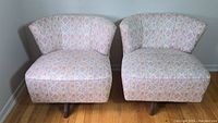 Front view of both chairs side by side showing overall appearance and matching upholstery pattern
