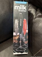 Front of product box showing three color options for PowerLix Professional Milk Frother including black, the item in the lot is black.