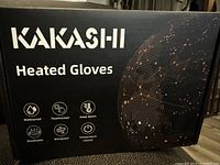 Box of Kakashi Heated Gloves highlighting waterproof, touchscreen, keep warm, breathable, windproof and temperature control features.