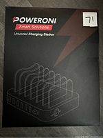 Front view of the product box showing brand, model name 'Universal Charging Station' and product illustration.